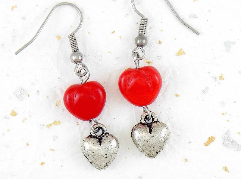 Long earrings with plump pewter hearts and bright red glass hearts, stainless steel hooks