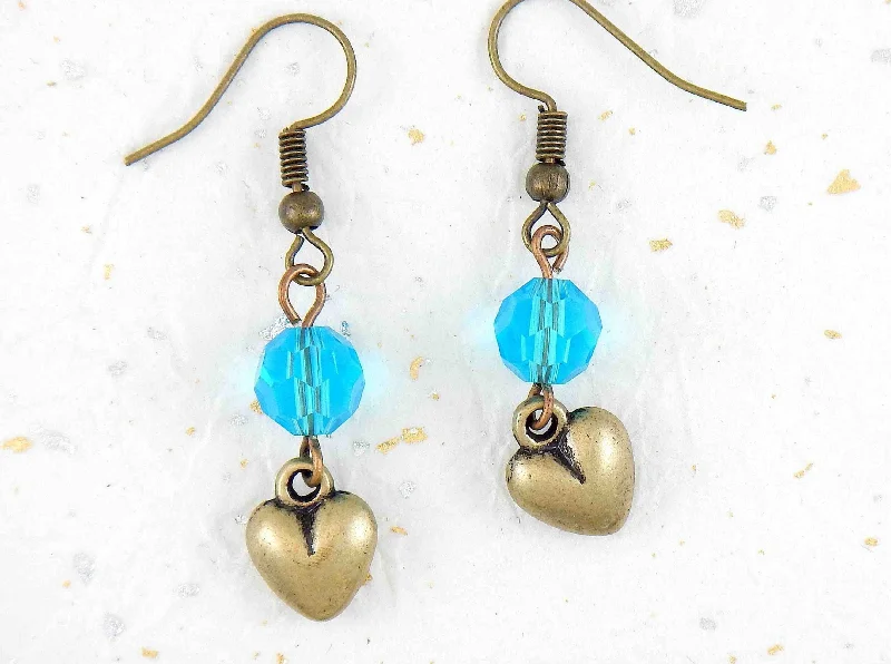 Long earrings with plump brass hearts and translucent turquoise faceted crystal balls, brass hooks