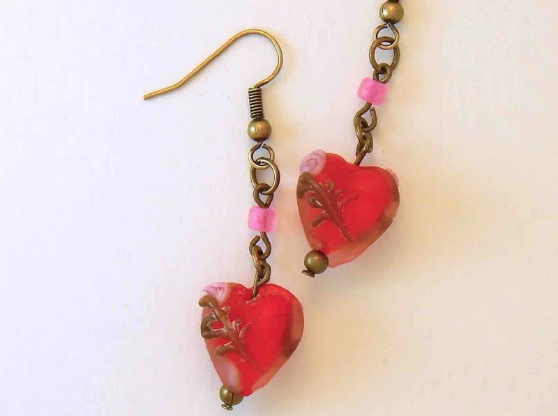 Long earrings with small frosted red glass hearts, rose details, brass hooks