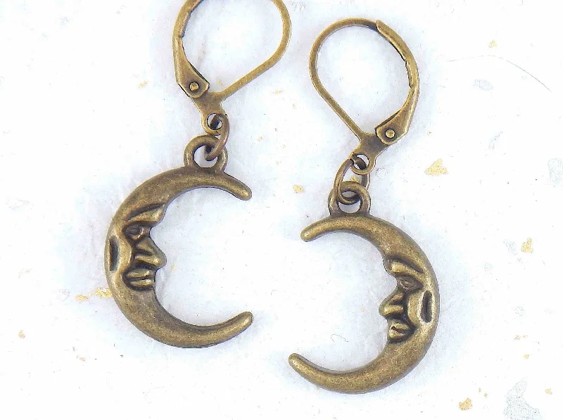 Short earrings, moon crescents with a face, brass lever back hooks