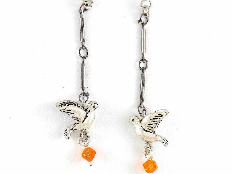 Long earrings with small pewter flying birds and orange Swarovski crystals, metal hooks